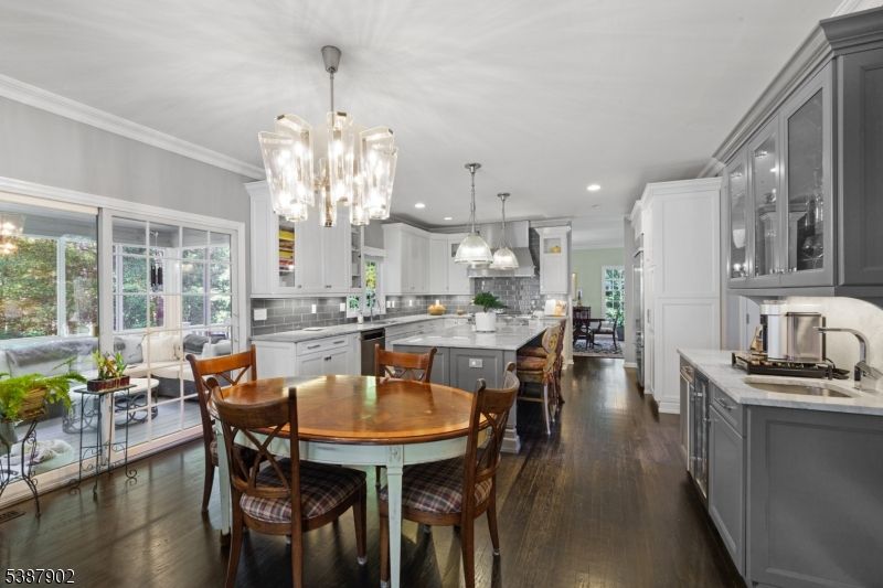 Chandelier, Dining room, Interior, Kitchen, Pendant Lights, Recessed Lighting, Stainless Steel Appliances, Wood Texture Flooring