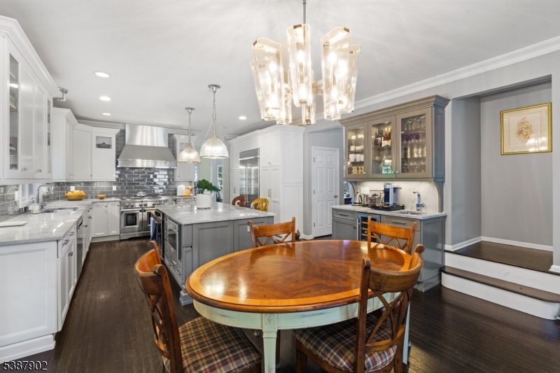 Chandelier, Dining room, Interior, Kitchen, Pendant Lights, Recessed Lighting, Stainless Steel Appliances, Wood Texture Flooring