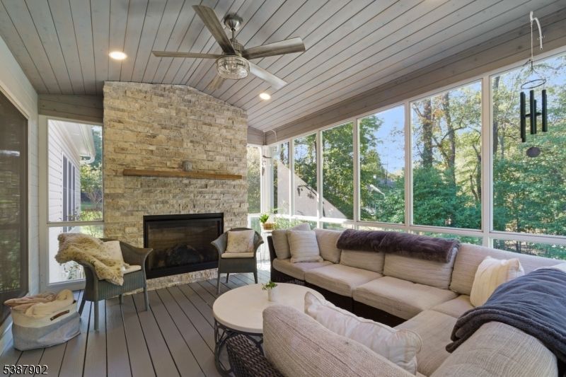 Fireplace, Interior, Living room, Recessed Lighting, Stone Walls, Sun Room, Wood Texture Flooring