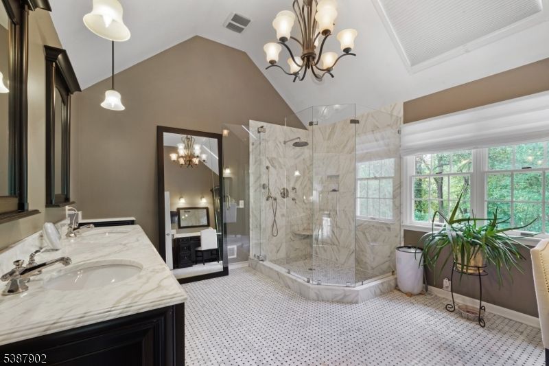 Bathroom, Chandelier, Dual Sink Vanities, Glass Shower, Interior, Marble Walls, Pendant Lights