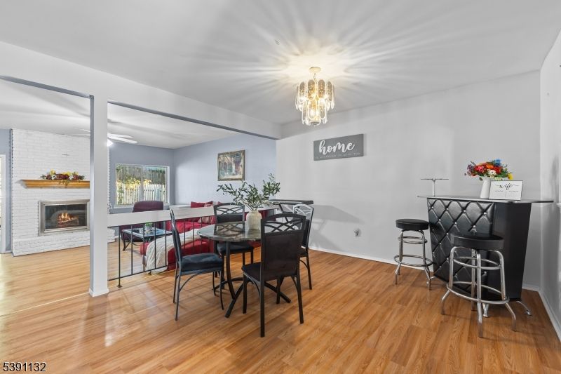 Chandelier, Dining room, Fireplace, Interior, Wood Texture Flooring