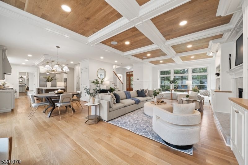 Chandelier, Dining room, Fireplace, Interior, Kitchen, Living room, Pendant Lights, Recessed Lighting, Wooden Ceilings, Wood Texture Flooring