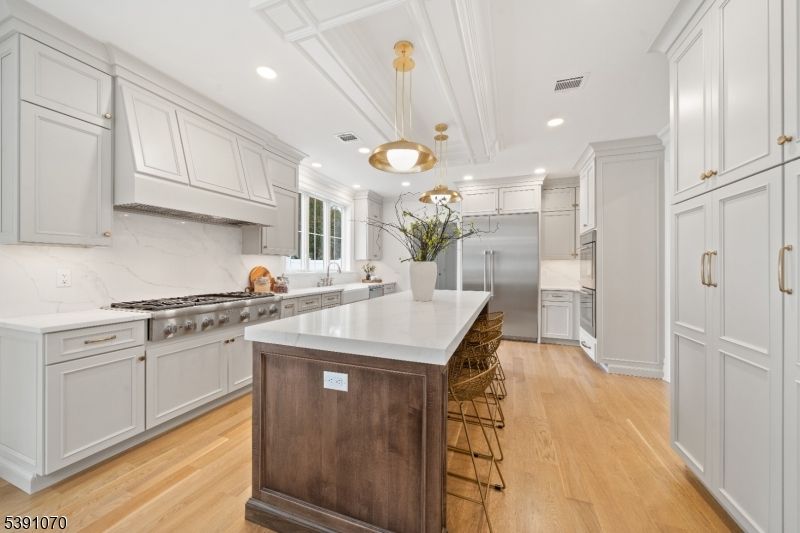 Interior, Kitchen, Marble Walls, Pendant Lights, Recessed Lighting, Stainless Steel Appliances, Wood Texture Flooring