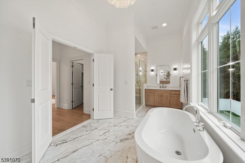 Bathroom, Chandelier, Free Standing Baths, Interior, Marble, Recessed Lighting, Wood Texture Flooring