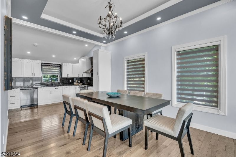 Chandelier, Dining room, Interior, Kitchen, Pendant Lights, Recessed Lighting, Stainless Steel Appliances, Wood Texture Flooring