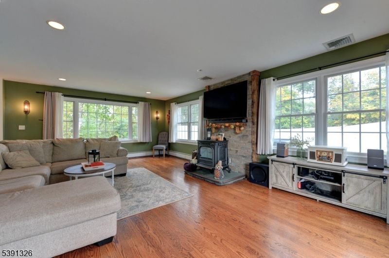 Fireplace, Fitness Equipment, Interior, Living room, Recessed Lighting, Wood Texture Flooring