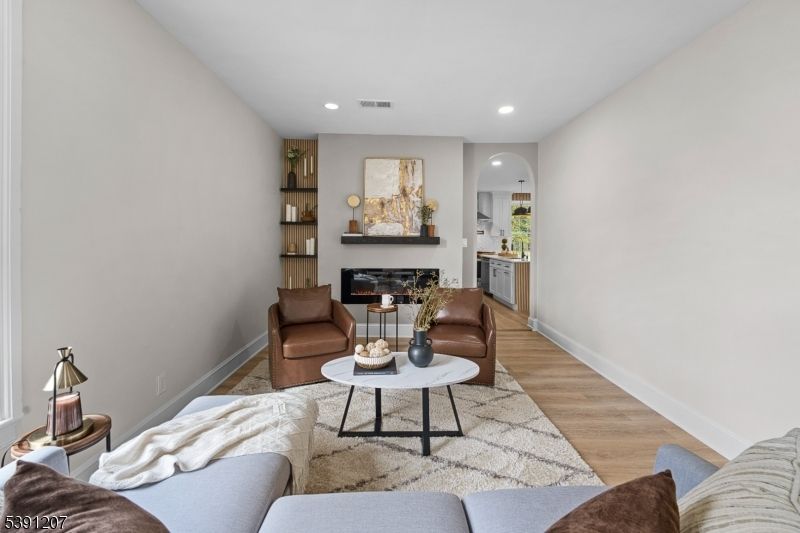 Fireplace, Interior, Living room, Recessed Lighting, Wood Texture Flooring