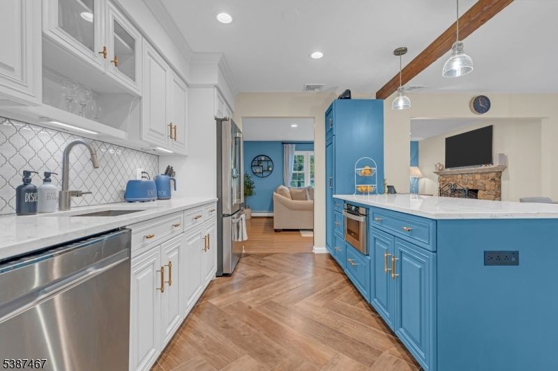 Fireplace, Interior, Kitchen, Pendant Lights, Recessed Lighting, Stainless Steel Appliances, Wood Texture Flooring