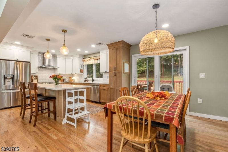 Dining room, Interior, Kitchen, Pendant Lights, Recessed Lighting, Stainless Steel Appliances, Wood Texture Flooring