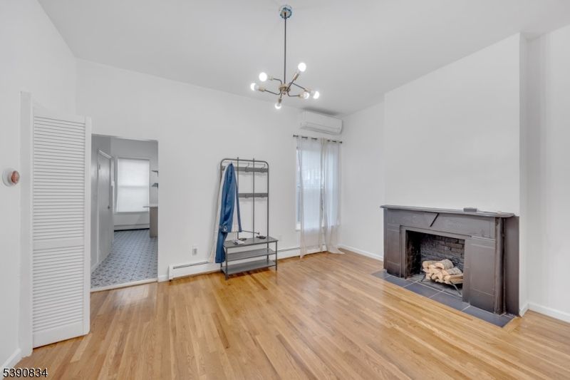 Empty room, Fireplace, Interior, Pendant Lights, Wood Texture Flooring