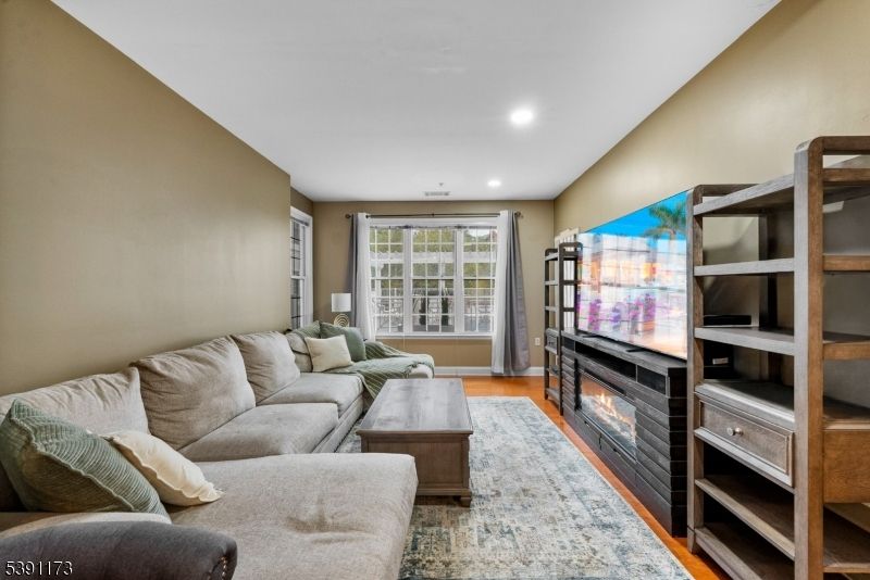 Fireplace, Interior, Living room, Recessed Lighting, Wood Texture Flooring