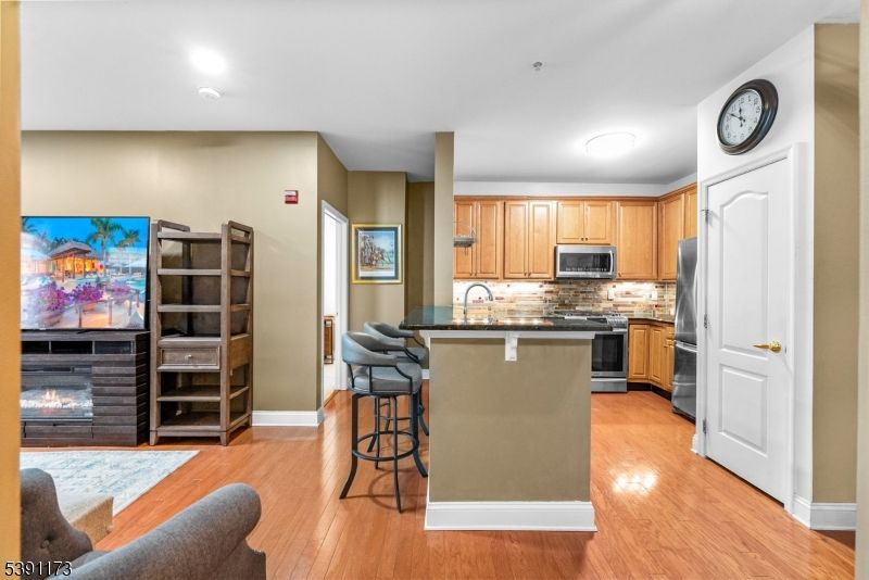 Fireplace, Interior, Kitchen, Recessed Lighting, Stainless Steel Appliances, Wood Texture Flooring