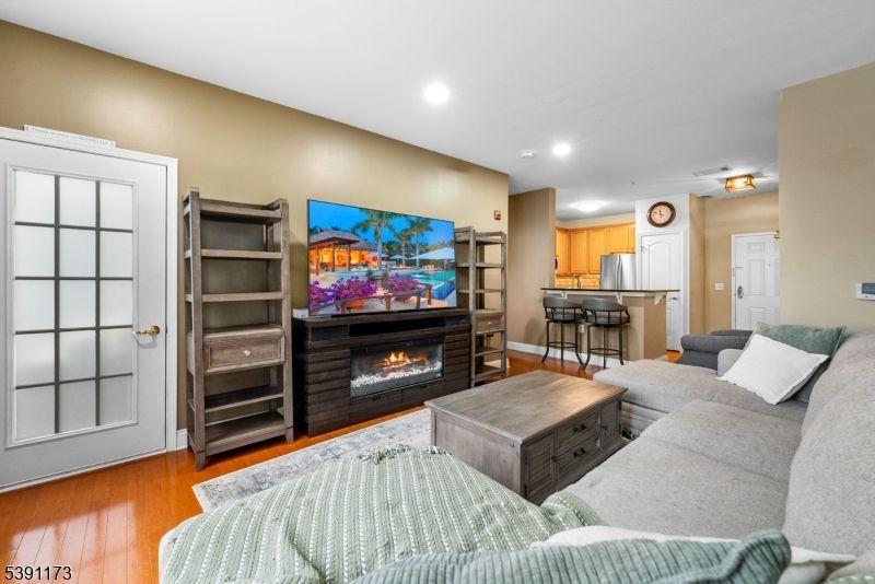 Fireplace, Interior, Kitchen, Living room, Recessed Lighting, Stainless Steel Appliances, Wood Texture Flooring