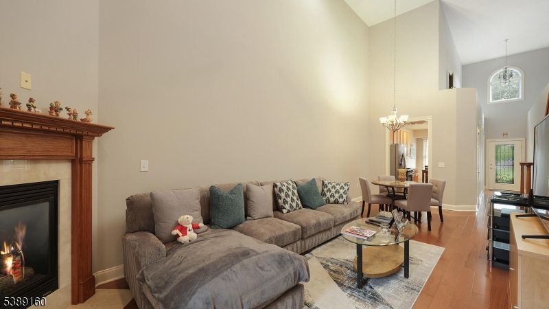 Chandelier, Dining room, Fireplace, Interior, Living room, Pendant Lights, Wood Texture Flooring