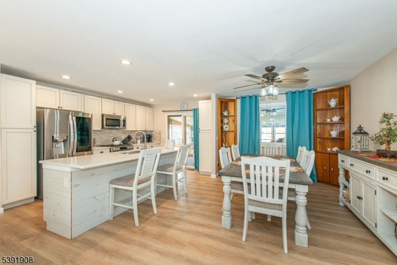 Dining room, Interior, Kitchen, Recessed Lighting, Stainless Steel Appliances, Wood Texture Flooring