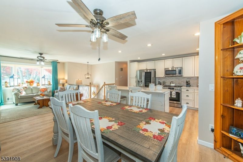 Dining room, Interior, Kitchen, Living room, Pendant Lights, Recessed Lighting, Stainless Steel Appliances, Wood Texture Flooring