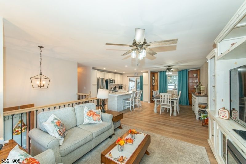 Dining room, Interior, Kitchen, Living room, Pendant Lights, Recessed Lighting, Stainless Steel Appliances, Wood Texture Flooring