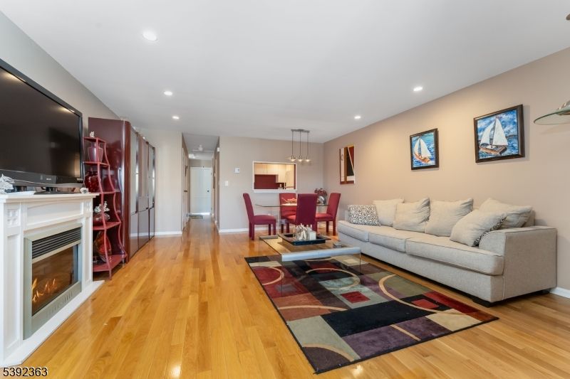 Dining room, Fireplace, Interior, Living room, Pendant Lights, Recessed Lighting, Wood Texture Flooring