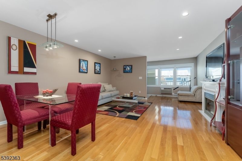 Dining room, Fireplace, Interior, Living room, Pendant Lights, Recessed Lighting, Wood Texture Flooring
