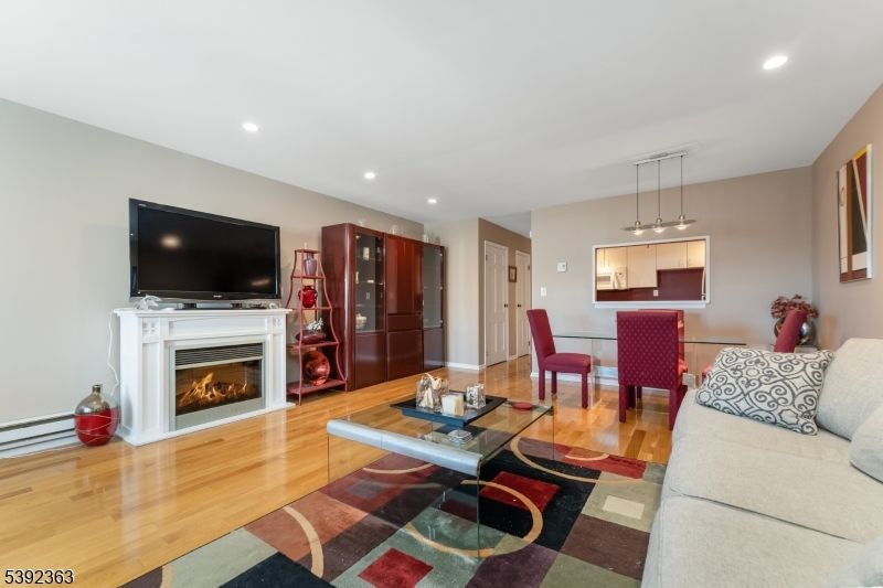 Dining room, Fireplace, Interior, Living room, Pendant Lights, Recessed Lighting, Wood Texture Flooring