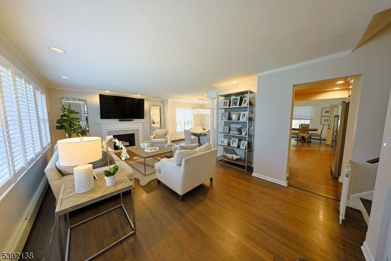 Dining room, Fireplace, Interior, Living room, Recessed Lighting, Wood Texture Flooring