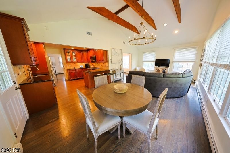 Chandelier, Dining room, Fireplace, Interior, Kitchen, Living room, Recessed Lighting, Wooden Beams, Wood Texture Flooring