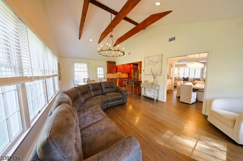 Chandelier, Dining room, Interior, Kitchen, Living room, Pendant Lights, Recessed Lighting, Wooden Beams, Wood Texture Flooring