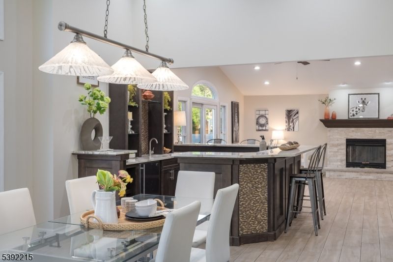 Dining room, Fireplace, Interior, Pendant Lights, Recessed Lighting, Wood Texture Flooring