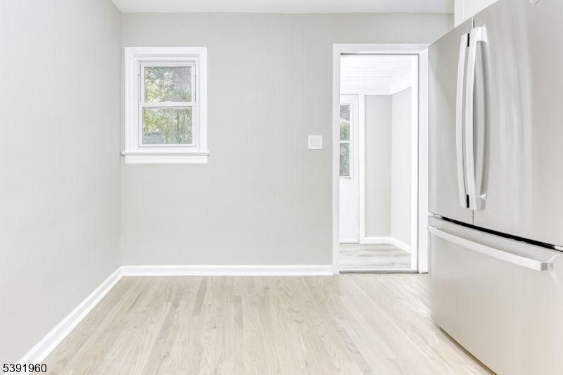 Empty room, Interior, Kitchen, Stainless Steel Appliances, Wood Texture Flooring