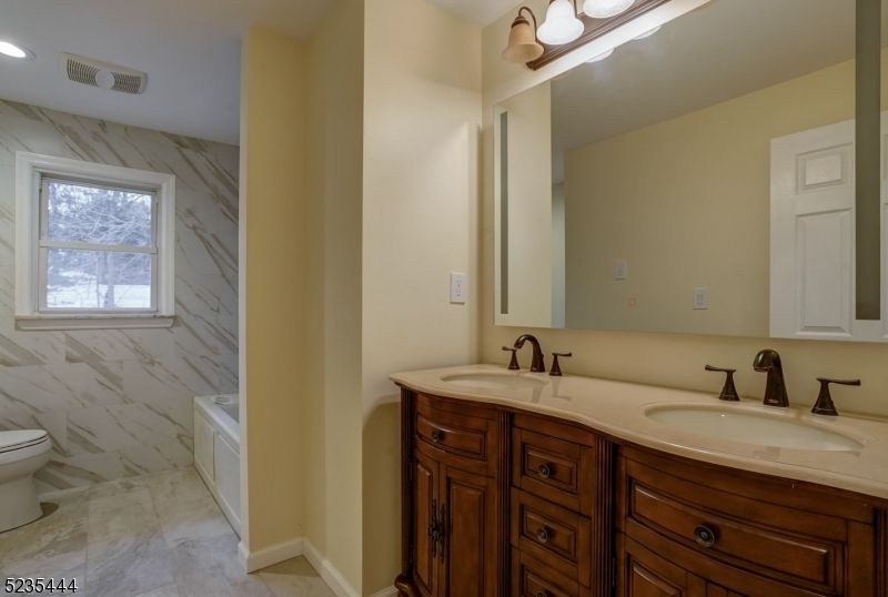 Bathroom, Dual Sink Vanities, Interior, Marble, Marble Walls, Recessed Lighting