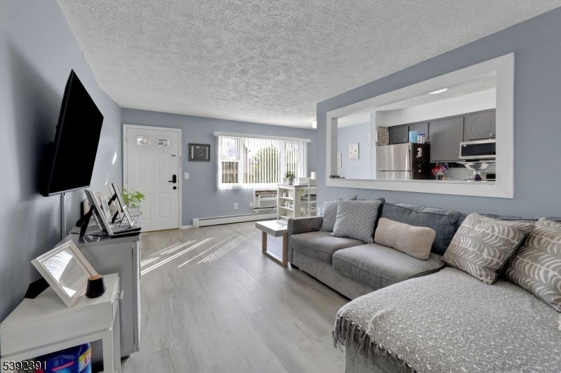 Dining room, Interior, Kitchen, Living room, Stainless Steel Appliances, Wood Texture Flooring