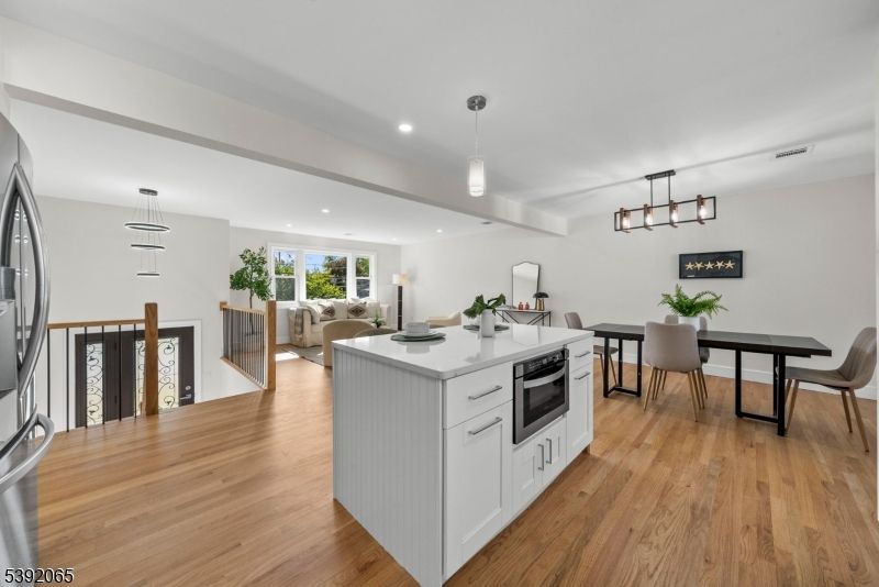 Dining room, Interior, Kitchen, Living room, Pendant Lights, Recessed Lighting, Stainless Steel Appliances, Wood Texture Flooring