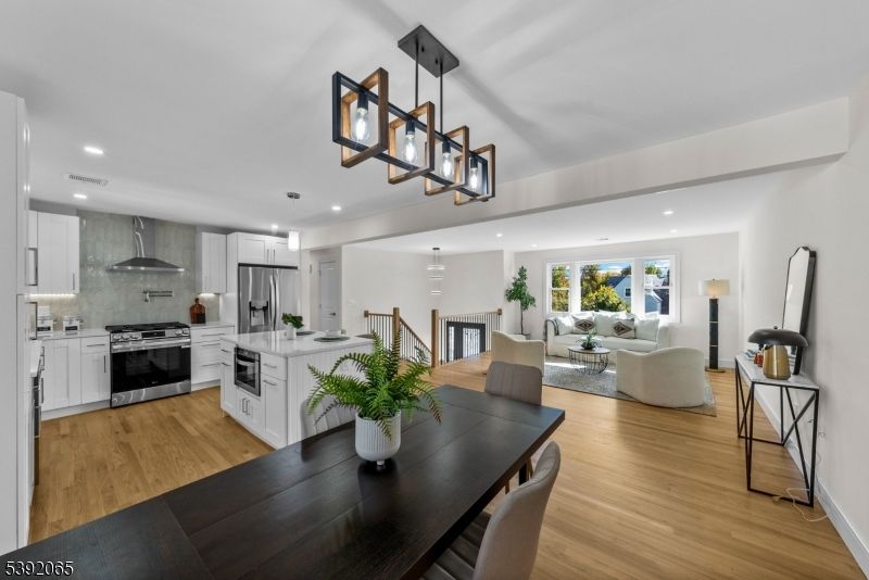 Dining room, Interior, Kitchen, Living room, Pendant Lights, Recessed Lighting, Stainless Steel Appliances, Wood Texture Flooring