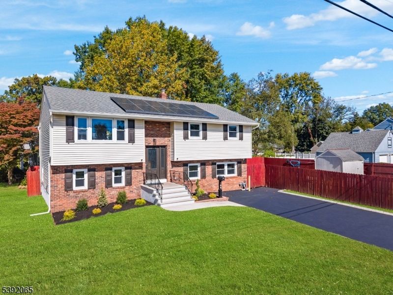 Exterior, Facade, Brick Facade, Solar Panels, Raised Ranch