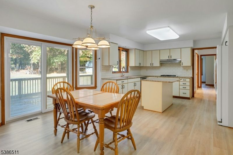 Dining room, Interior, Kitchen, Pendant Lights, Stainless Steel Appliances, Wood Texture Flooring