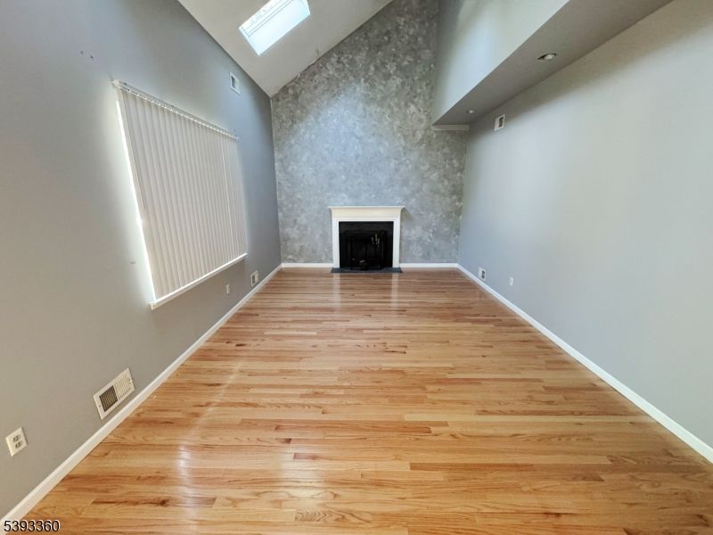 Empty room, Fireplace, Interior, Recessed Lighting, Wood Texture Flooring