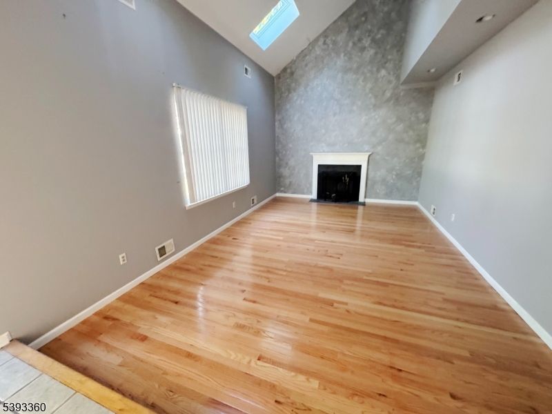 Empty room, Fireplace, Interior, Recessed Lighting, Wood Texture Flooring