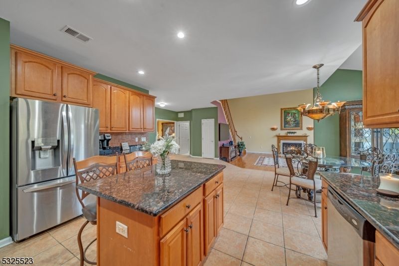 Chandelier, Dining room, Fireplace, Interior, Kitchen, Recessed Lighting, Stainless Steel Appliances