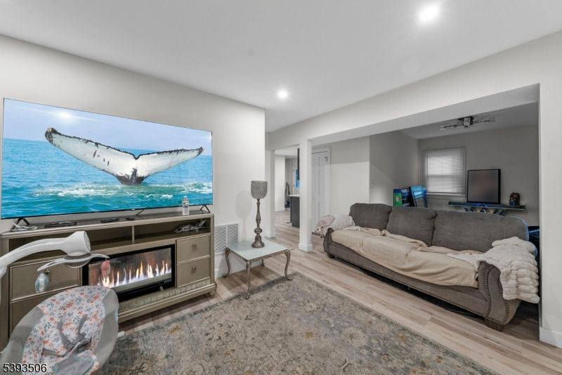 Fireplace, Interior, Living room, Recessed Lighting, Water, Wood Texture Flooring