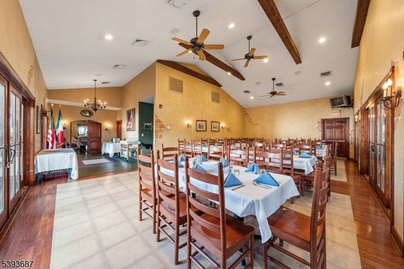 Chandelier, Dining room, Fireplace, Interior, Living room, Recessed Lighting, Wooden Beams, Wood Texture Flooring