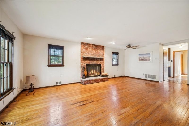 Empty room, Fireplace, Interior, Recessed Lighting, Stone Walls, Wood Texture Flooring