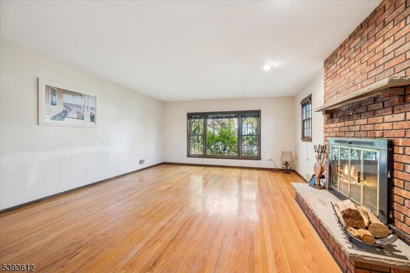 Empty room, Fireplace, Interior, Recessed Lighting, Stone Walls, Wood Texture Flooring