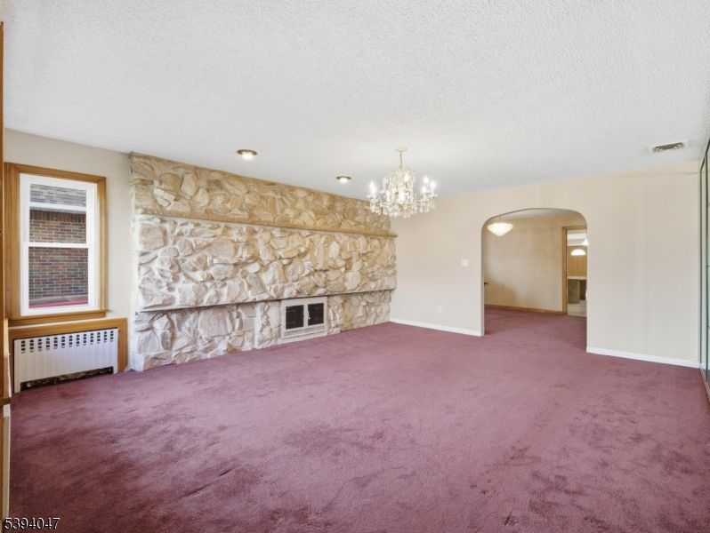 Chandelier, Empty room, Fireplace, Interior, Recessed Lighting, Stone Walls