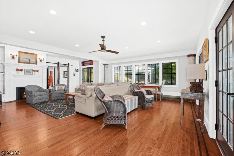 Dining room, Fireplace, Interior, Living room, Recessed Lighting, Wood Texture Flooring
