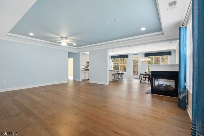 Dining room, Empty room, Fireplace, Interior, Pendant Lights, Recessed Lighting, Wood Texture Flooring