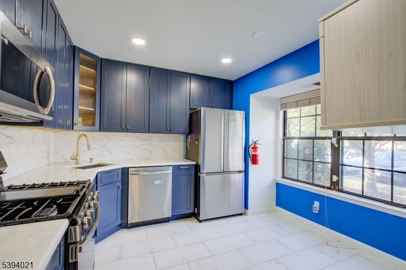 Interior, Kitchen, Marble, Marble Walls, Recessed Lighting, Stainless Steel Appliances