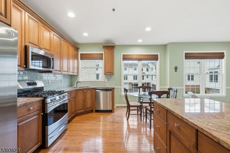 Dining room, Interior, Kitchen, Recessed Lighting, Stainless Steel Appliances, Wood Texture Flooring