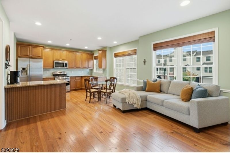 Dining room, Interior, Kitchen, Living room, Recessed Lighting, Stainless Steel Appliances, Wood Texture Flooring