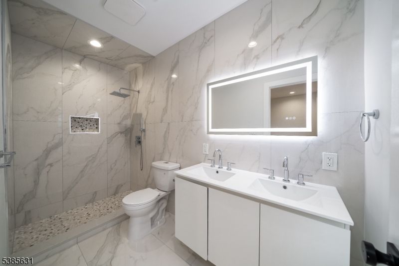 Bathroom, Dual Sink Vanities, Glass Shower, Interior, Marble, Marble Walls, Recessed Lighting