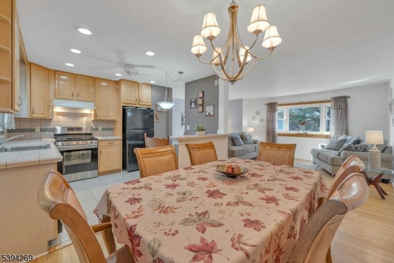 Chandelier, Dining room, Interior, Kitchen, Living room, Recessed Lighting, Wood Texture Flooring